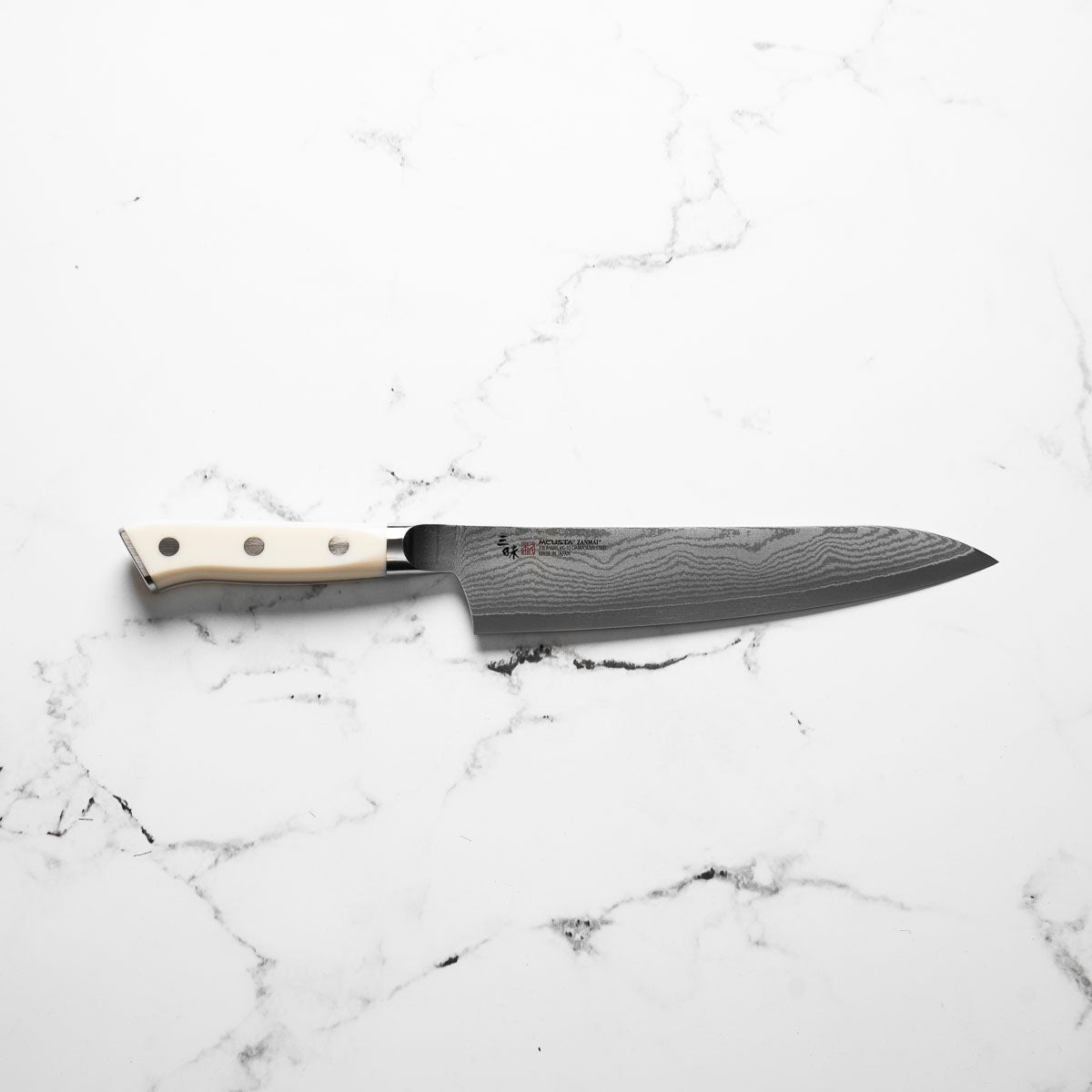 Mcusta Zanmai Corian Classic VG10 Damascus Gyuto 210mm - handle detail
