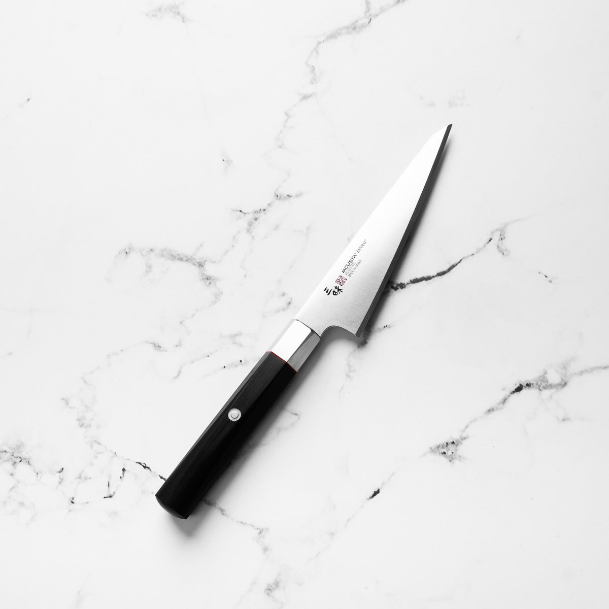 Mcusta Zanmai "Hybrid" VG10 Honesuki 145mm - angled view