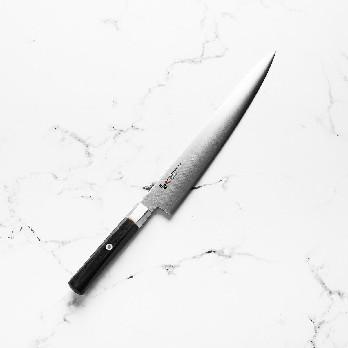 Mcusta Zanmai "Hybrid" VG10 Sujihiki 270mm - angled view